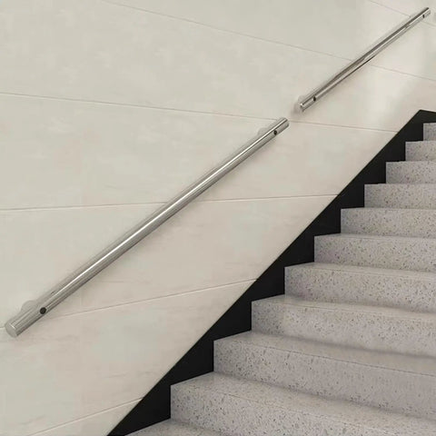 Heavy Duty Stainless Steel Handrail For Stairs And Decks Round Pipe Railing System Wall Mounted Indoor Outdoor 16 Foot Length mounted on white wall beside stairs.