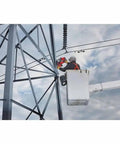 Portable Lineman Magnetic Drill Kit being used for power drilling on a tall structure by a worker in a bucket truck.