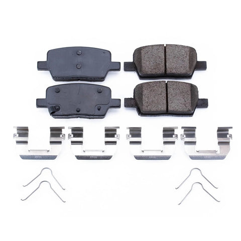 PowerStop ceramic rear brake pads with installation hardware; four pads visible (top view)