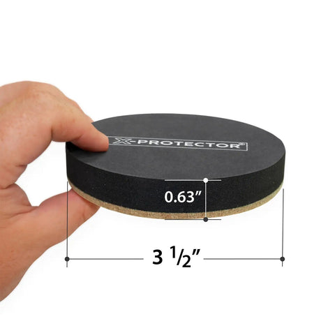 Hand holding Heavy Duty Felt Furniture Slider with dimensions, 3 1/2 inch by 0.63 inch, X-Protector shown.