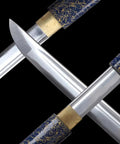 Close-up of Full Tang High Carbon Steel Iaido Samurai Sword with blue lacquer scabbard details showing blade and handle.