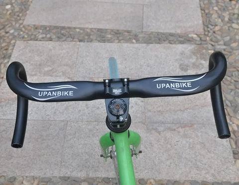 31.8mm Drop Handlebar 420mm Aluminum Alloy 7075 Road And BMX Bike Bar mounted on green bicycle, top view