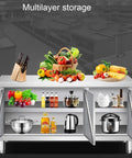 Commercial Grade Stainless Steel Prep Table With Deep Storage Cabinets Tough As Nails Construction For Restaurants Garages Cafes Or Outdoor Workshop Projects 180X80Cm with fruits, vegetables, and kitchen utensils.