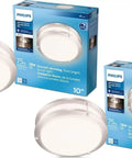 Two LED ceiling lights with packaging, Philips 75W, 16W dimmable, 10-inch, featuring smooth dimming and gradient light.