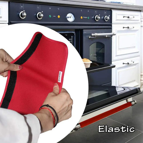 Hand holding red neoprene guard for oven door, part of the Slick Red Neoprene Fridge Door Handle Covers 4 Pack Soft Cushioned Kitchen Appliance Protectors Keep Your Setup Tight And Fingerprint Free For Ovens And Dishwashers.