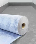 Boss Grade Waterproof Membrane Roll Featuring Zero Hassle Diy Cutting For Roof Leak Blocking And Bathroom Shower Pan Sealing laid on a concrete surface.