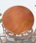 Top view of Big Shot Wooden Lazy Susan Serving Tray Smooth Operator turntable on a round dining table with place settings.