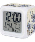 Chunky Cube Alarm Clock With Bright Led Panel And Seven Color Night Light Sturdy Plastic Housing displaying time and temperature.