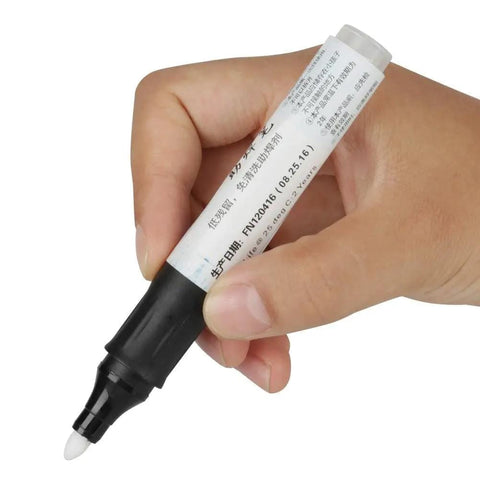 Person holding Flux Pen With Smooth Flux For Soldering SMD PCB And Through Hole Joints Low Solids Flux For Precise Clean And Uniform Connections