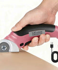 Heavy Duty Cordless Electric Scissors With Fast Usb Rechargeable Power And Self Sharpening Steel Blades For Slick Cuts Through Denim Fabric Leather Carpet And Stubborn Cardboard In Nifty Pink, cutting through cardboard.