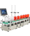 Heavy Duty Automatic Liquid Filling Machine On Rugged Conveyor Belt with dual nozzles and jars of red liquid for beverages.