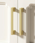 Gold Brushed Cabinet Handle Set Of 20 With Five Inch Center To Center Square Pulls installed on white cabinet doors.