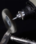 Stainless Steel Wire Wheel Brush 25mm T-Type on rotary tool, crimped bristle cleaning metal surface, with 1/8 inch shank, pro grade use.