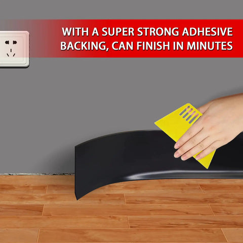 Person using a yellow tool to apply Top Notch Vinyl Wall Base Molding Four Inch Wide Peel And Stick Self Adhesive Rubber Floor Trim.
