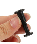 Premium Binding Screws And Countersunk Cap Nuts Designed For Hassle Free Install On Scrapbooks close-up of black binding screw in hand