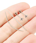 Close-up of Titanium Threadless Flat Back 20G Jewelry For Women Earrings Nose Ring 10mm with 3mm Cubic Zirconia Stud on fingers
