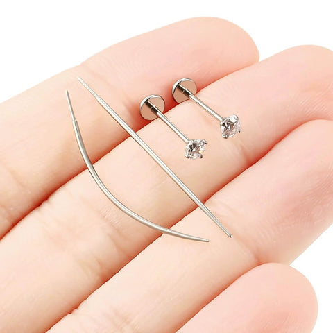 Close-up of Titanium Threadless Flat Back 20G Jewelry For Women Earrings Nose Ring 10mm with 3mm Cubic Zirconia Stud on fingers