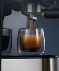 Go Big Or Go Home Daily Grind Semi Automatic Espresso Machine With 20 Bar Pressure brewing espresso into a glass cup.