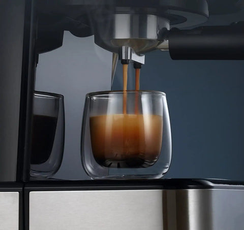 Go Big Or Go Home Daily Grind Semi Automatic Espresso Machine With 20 Bar Pressure brewing espresso into a glass cup.