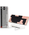 Two Tier Keyboard Display Stand In Clear White Acrylic For Two Mechanical Keyboards Storage And Display Shelf Easy Assembly No Tools Required Keeps Your Desk Lookin Sharp Sleek Desk Organizer For Home Office with two angled keyboards.