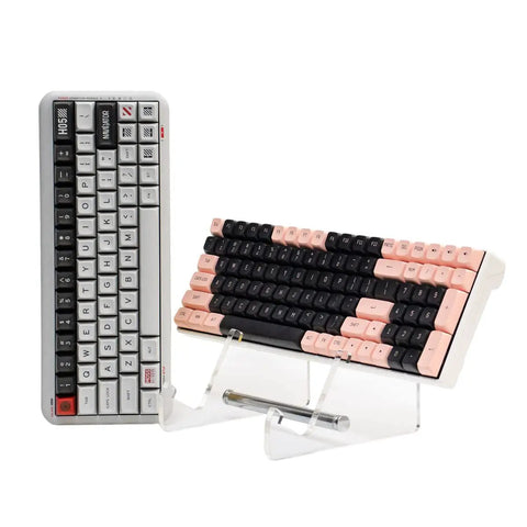 Two Tier Keyboard Display Stand In Clear White Acrylic For Two Mechanical Keyboards Storage And Display Shelf Easy Assembly No Tools Required Keeps Your Desk Lookin Sharp Sleek Desk Organizer For Home Office with two angled keyboards.