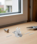 Precision Mini Vise Aluminum Alloy Workholding Tool With Stable Nonmarring Grip on a workbench with small parts and tools.