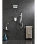 Shower System with Waterfall Rainfall Head and Handheld, Wall-Mounted on dark stone wall with modern towel rack.