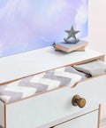 Open dresser drawer with an Antique Brass Cabinet Knob 6 Pack With Spacers And Backplates, vintage style hardware.