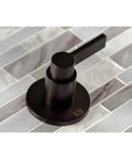 NuvoFusion Double-Handle Tub And Shower Faucet in polished brass with geometric design on tiled background, top view