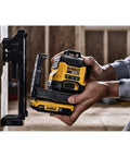 Person using 20V Max Laser Level Kit with Cross Line and 3x360 Green Beams, Self Leveling Lines on construction site