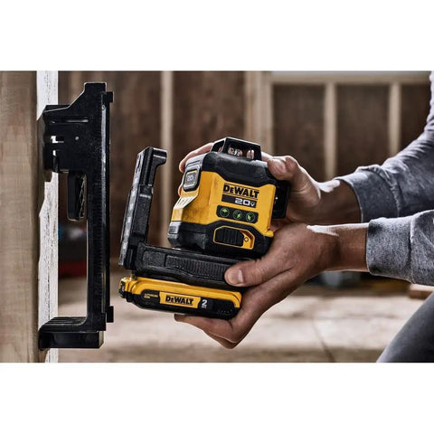 Person using 20V Max Laser Level Kit with Cross Line and 3x360 Green Beams, Self Leveling Lines on construction site
