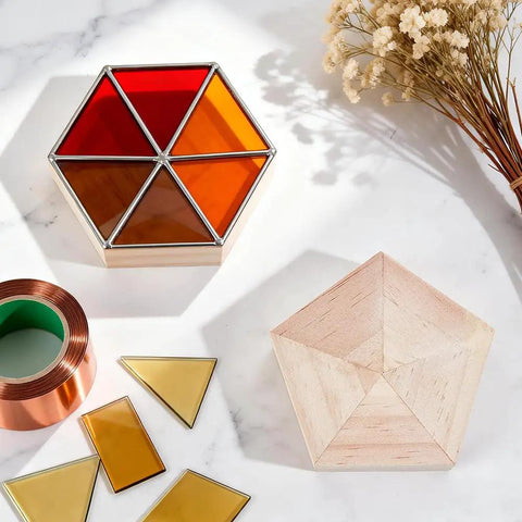 Hella Reliable Wood And Glass Soldering Jig Set Featuring Hexagon And Pentagon Molds on a surface with stained glass pieces