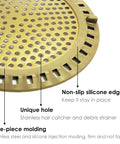 Gold Stainless Steel Shower Drain Catcher With Soft Silicone Edge Flat Round Tub Strainer detail showing unique holes and silicone rim.
