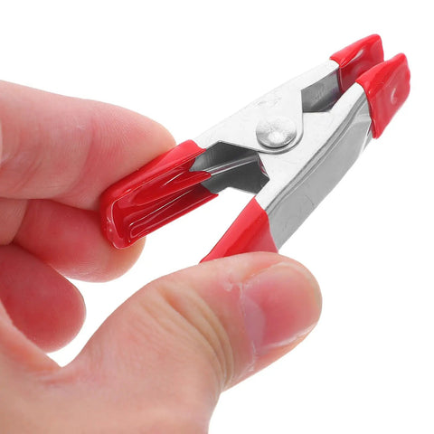 Heavy Duty 2-Inch Metal Spring Clamps Kit With Rock Solid Grip For Woodworking Diy Projects Outdoor Tents And Studio Backgrounds That Hold Tight, red metal clamp close-up