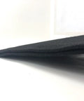 Side angle of Gap Pad For Golf Simulator Frame And Screen Seam Filler That Keeps Gaps Out And Prevents Screen Damage, in black.