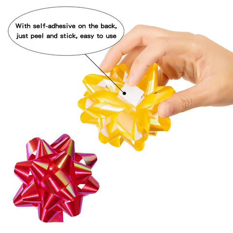 Hand holding self-adhesive yellow bow from 100 Pcs Bright Bows And Ribbon Assortment Set For Gift Wrapping with red bow beside
