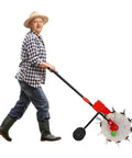 Person using 10 Nozzle Hand Pushed Seeder With 8.27 Pounds Seed Storage Box Adjustable Sowing Quantity And Depth Wheeled Planter