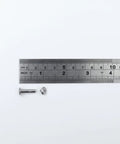 Rock Solid Pro Grade Stainless Steel Barrel Nuts And Bolts Kit With Hex Binding Post Screws and Rust Proof M3x16mm hardware next to ruler.
