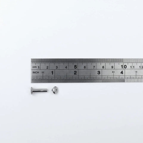 Rock Solid Pro Grade Stainless Steel Barrel Nuts And Bolts Kit With Hex Binding Post Screws and Rust Proof M3x16mm hardware next to ruler.