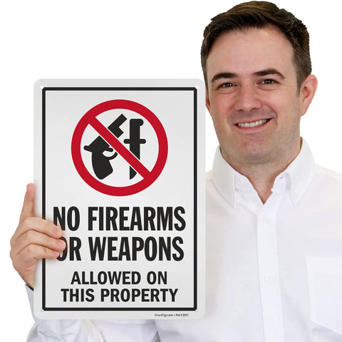 Straight Talk For Your Property With This Built Tough 14X10 Inch Rustproof Aluminum Yard Sign that shows No Firearms or Weapons Allowed.