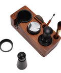 Portable Solid 58mm Stainless Steel Coffee Tamper Kit With Wooden Tamping Station Needle Tool And Quick Clean Brush on a wooden base.