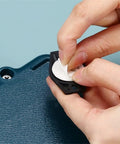 Heavy Duty Self Adhesive Furniture Casters With Stainless Steel Swivel Rollers showing the removal of adhesive backing for installation.