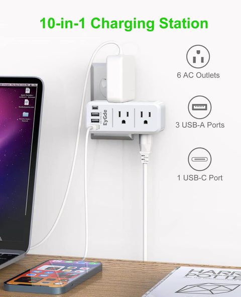 Transforms One Outlet Into Six With Rotating Plug And USB Ports 1700J Surge Protector in use beside laptop