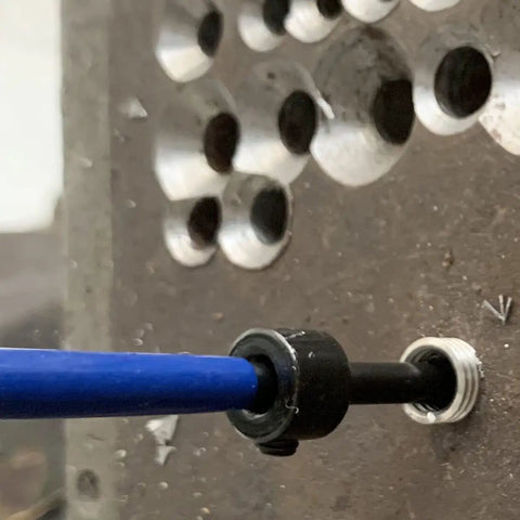 Installation of M5 X 0.8 Helical STI Thread Repair Kit in metal with tool in use