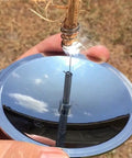 Person using Solar Fire Spark Starter For Camping And Survival Windproof Lighter And Fire Ignition Tool Lightweight Outdoor Emergency Kit