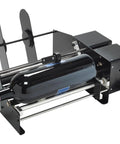 Heavy Duty Automatic Label Applicator With Plug And Play Tool Free Swaps For Rock Solid Dual Sticker Alignment At Slick Speeds Up To 1200 Per Hour Zero Wrench Adjustments Fast Track Production Ready Black with a bottle on it.