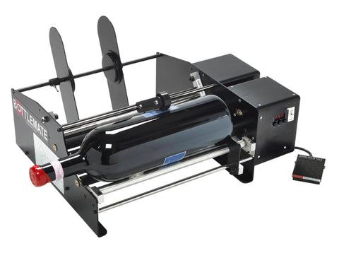 Heavy Duty Automatic Label Applicator With Plug And Play Tool Free Swaps For Rock Solid Dual Sticker Alignment At Slick Speeds Up To 1200 Per Hour Zero Wrench Adjustments Fast Track Production Ready Black with a bottle on it.