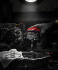 Heavy Duty Automotive Actuator Assembly Rock Solid Transmission Shifter Unit being installed with red seals on a gear assembly.
