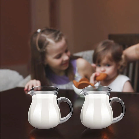 Two children enjoying breakfast with 8 Pack 4 Oz Glass Creamer Pitchers Set Clear Milk Pourers For Coffee Tea Syrups Mini Glass Pitchers