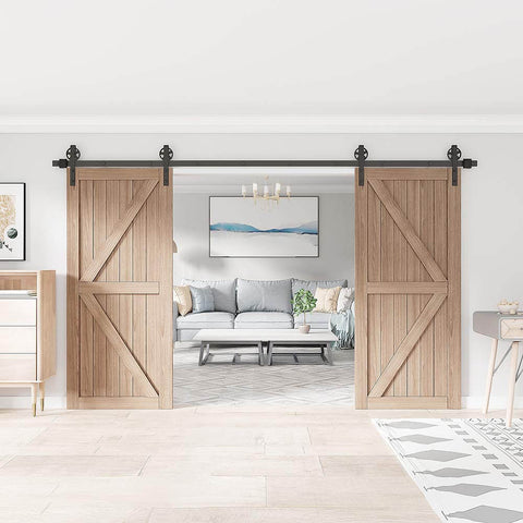 Black Wood Double Sliding Barn Door Hardware Kit With Big Spoke Wheel Rollers, visible in a modern interior setting.